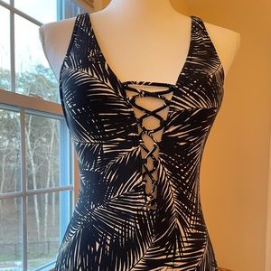 One piece low cut with open back adjustable straps